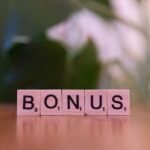 A close up of a scrabble type word on a table